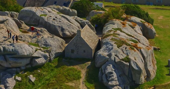 France, Meneham, 26 February 2025: Aerial view of an ancient stone house in the rocks