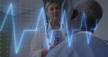 Image of cardiograph over caucasian female doctor examining her patient in hospital