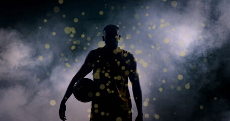 Image of light spots over african american male basketball player
