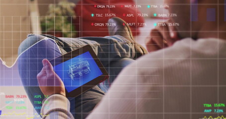 Image of financial data processing over caucasian man using tablet
