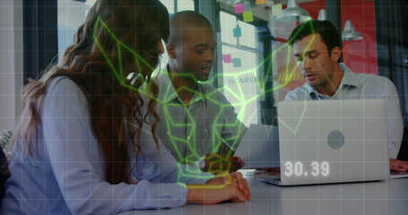 Business team discussing project over holographic data image in modern office