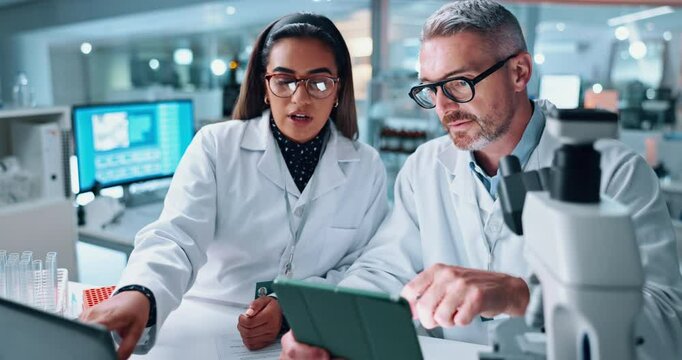 Scientist, people and team with tablet for microscope, chemistry testing and medical research. Biotech, laboratory and mentor with assistant for pharmaceutical comparison or pathology experiment