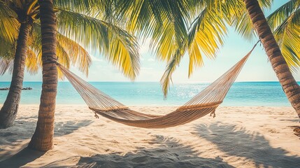 Fototapeta premium A serene beach scene featuring a hammock strung between palm trees, with sandy shores and a tranquil ocean in the background.