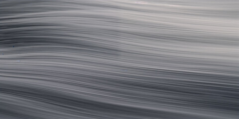 Fototapeta premium Abstract gray waves background showcasing smooth textures and fluid motion.