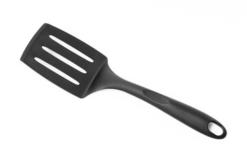 Ladle, turner, kitchen utensils isolated on white. Kitchen spatula on isolated white background. Black plastic kitchen spatula isolated on white background. A set of kitchen utensils.