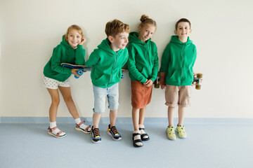 Kids in green hoodie school uniform