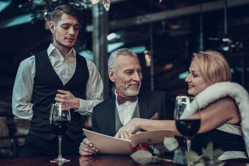 Couple Resting in Restaurant and Woman made choice