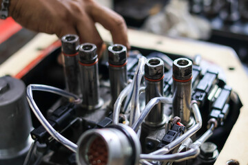 Obraz premium Installing Control Valve Automatic Transmission in workshop services, assembly automatic transmission at Transindo Balikpapan
