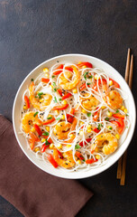 Rice noodles with shrimp, pepper and corn. Seafood. Asian cuisine.