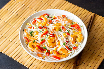 Rice noodles with shrimp, pepper and corn. Seafood. Asian cuisine.