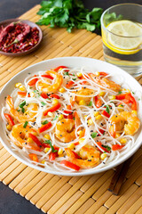Rice noodles with shrimp, pepper and corn. Seafood. Asian cuisine.