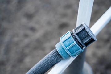Clogged water hose in the morning in winter close-up