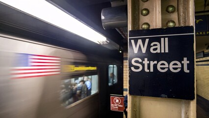 Wall Street Subway Station with Passing Train and American Flag