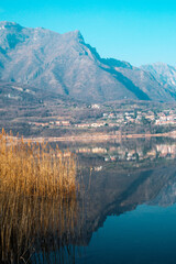 Tranquil View of Lago di Annone with Mountain Reflection in Brianza, Italy