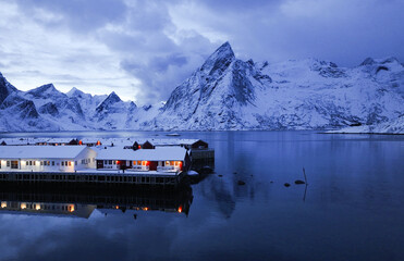 A Serene Winter Landscape Featuring Majestic SnowCovered Mountains and Reflective Waters in Nature