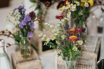 Charming wildflower arrangement on rustic boxes.