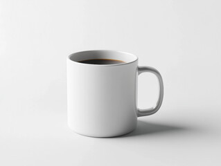 Fototapeta premium A white coffee cup with a dark brown liquid in it