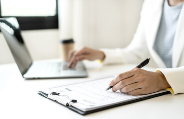Business woman employer holding resume hiring recruit looking cv resume to hire candidates, analyzing information before job interview. Recruitment concepts