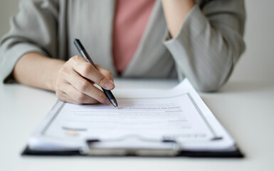 Business woman employer holding resume hiring recruit looking cv resume to hire candidates, analyzing information before job interview. Recruitment concepts