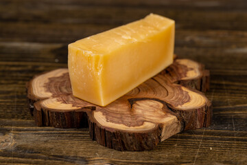 a piece of sliced hard mature cheese in close-up