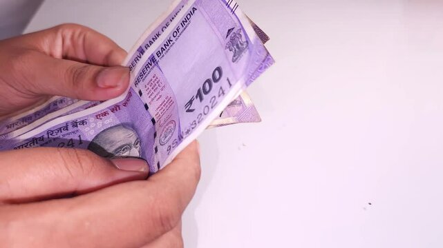 woman's hands counting Indian currency notes  Indian cash money of 500, 200 and 100 rupees