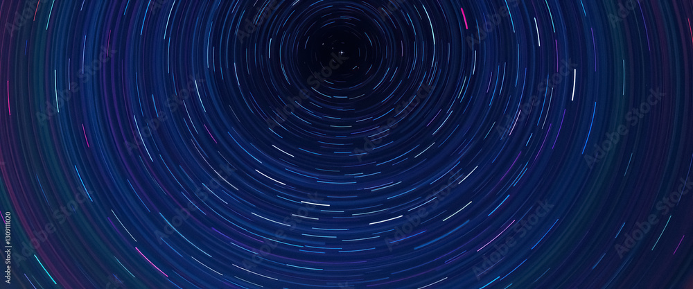 Poster Long exposure captures circular paths of stars in mesmerizing celestial display above horizon