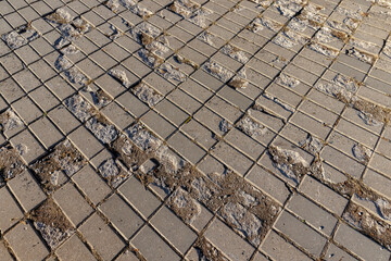 damaged and destroyed concrete tiles in the park