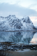 The breathtaking views of Snowy Mountain Reflections mirrored in the serene lake around it