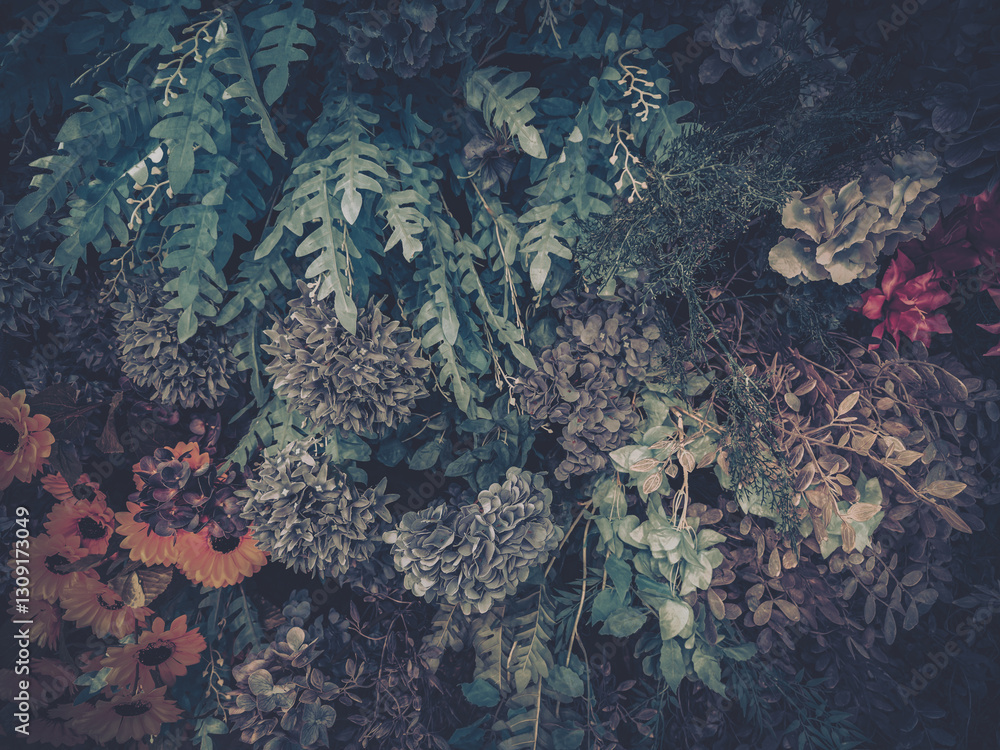 Poster artificial flowers and foliage create a textured botanical display. various blooms and leaves are ar