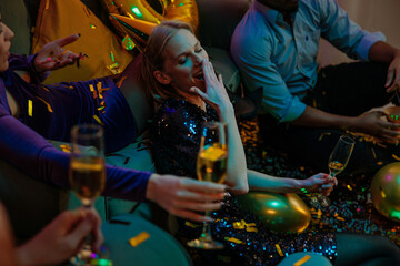 Bored Woman Yawning at Birthday Party with Friends Drinking Champagne