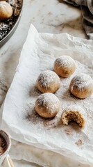 Fototapeta premium Perfectly round nut balls with protein powder and cocoa arranged on parchment paper with a touch of cocoa dust