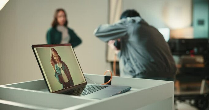 Backstage, laptop screen and photography with people in studio for photo shoot or production. Behind the scenes, computer or display with model and photographer in session for magazine or media