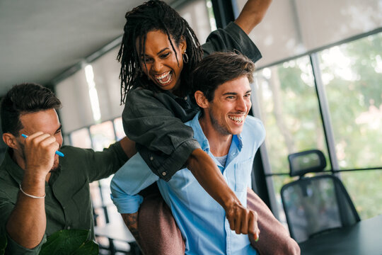 Joyful, excited diverse entrepreneurs are celebrating their success and the great work environment