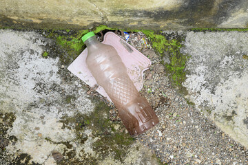 Drainage clogged with plastic bottle waste