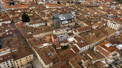 Fototapeta premium Aerial view of the church of Santa Maria Paganica in the historic center of L'Aquila, Abruzzo, Italy. The roof was destroyed by an earthquake.
