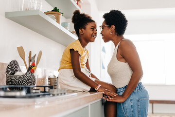 The bond between mother and daughter: Woman sharing a face to face moment with her child