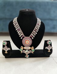 beautiful dual tone silver traditional jewellery with big magenta stone pendant. Heavy necklace...