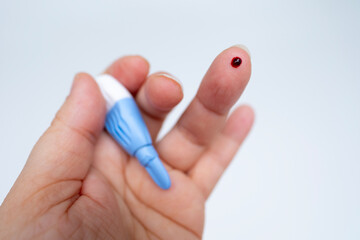 Finger with drop blood and lancet, medical testing and diagnostics, Blood collection supplies, healthcare self-diagnostics, laboratory procedures, self-care monitoring