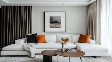 White sectional sofa with orange pillows in living room with art and drapes
