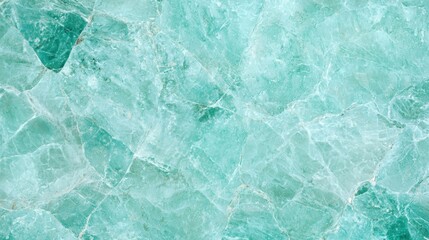 Close-up of turquoise marble texture with veined patterns