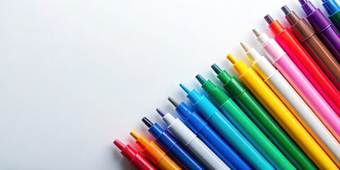 Fototapeta premium Bird's-Eye View of Colorful Permanent Markers on White Background - Copy Space