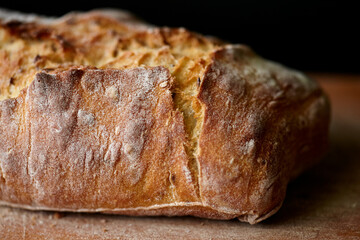 Detail of Sourdough Bread with Cracks and Flour Dust. Flaxseed Bread