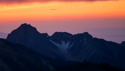 Fototapeta premium Majestic Mountain Silhouette at Sunrise Dramatic Fiery Sky Landscape Photography