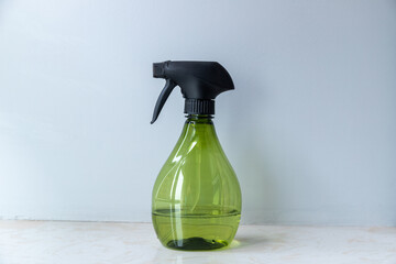 Spray bottle of freshener on windowsill
