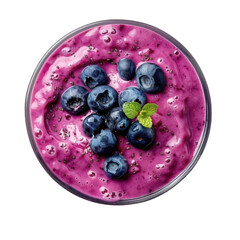 Fresh berry smoothie bowl topped with blueberries and mint leaves served in a clear glass, perfect for breakfast or a healthy snack any time of day