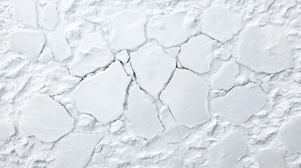 Obraz premium Aerial View of Fragmented Ice Texture on a White Water Surface in a Frozen Winter Landscape
