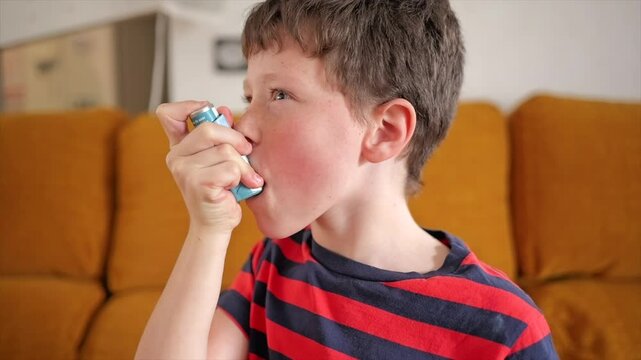 Child managing asthma with inhaler during a sunny afternoon indoors