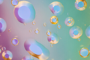 Fototapeta premium stunning macro shot of oil droplets in water with a multicolored background