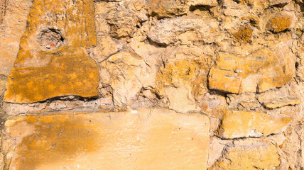 Background wall of ancient beige stones of old blocks aesthetic in light sandy colors