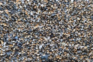 Seamless background from small river stones to create endless texture seed